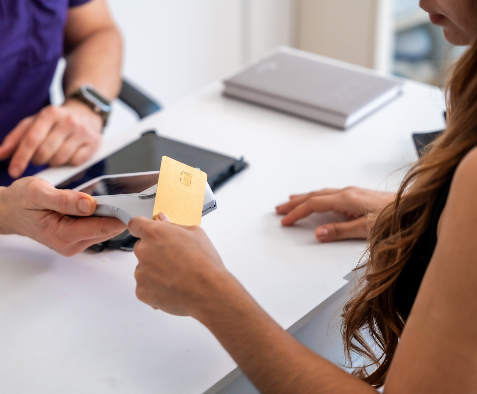 woman paying for medical procedure woman paying for medical procedure