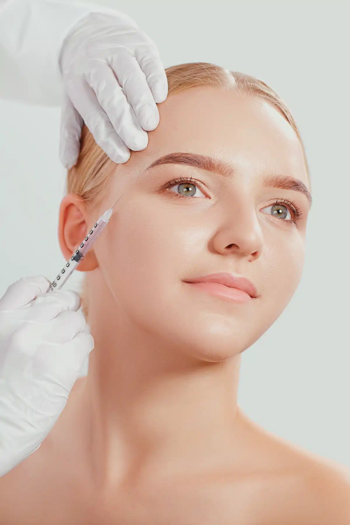 woman receiving botox injections woman receiving botox injections