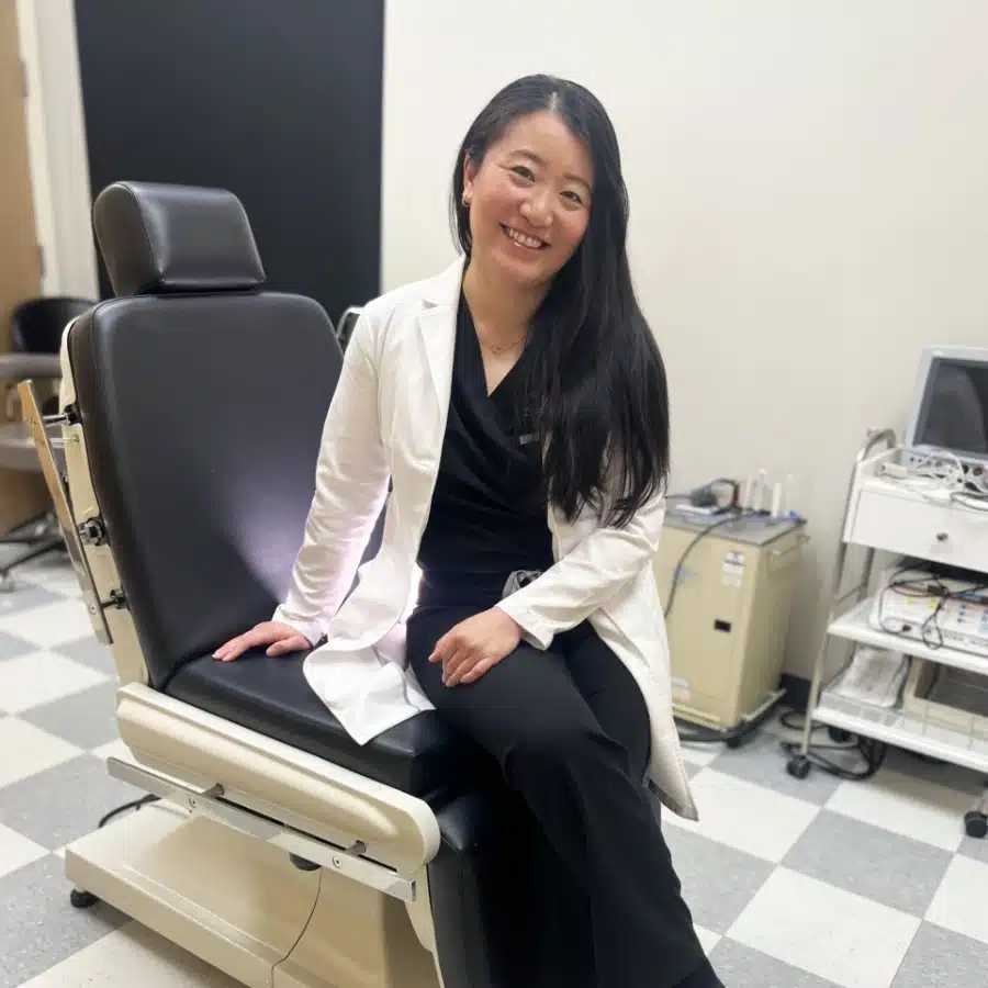 doctor beckman sitting in clinic smiling doctor beckman sitting in clinic smiling